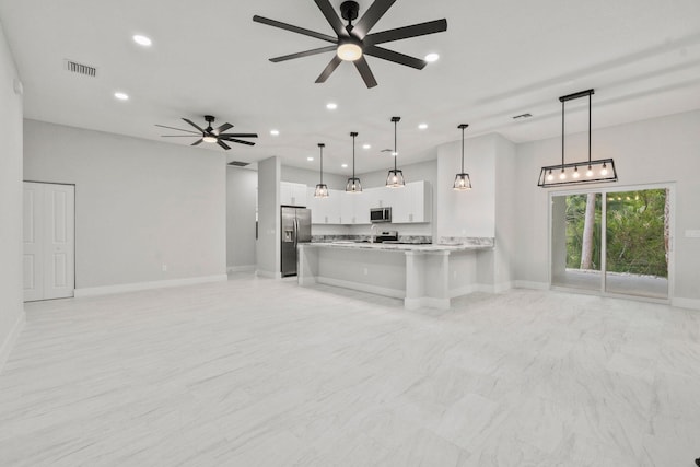 899 Gladiola Ave, Sebastian, FL 32958 - kitchen with a ceiling fan, open floor plan, appliances with stainless steel finishes, and visible vents