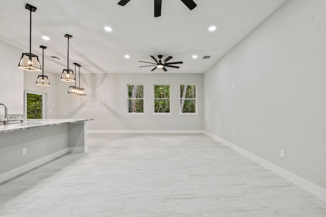 899 Gladiola Ave, Sebastian, FL 32958 - unfurnished living room featuring plenty of natural light, a ceiling fan, and recessed lighting
