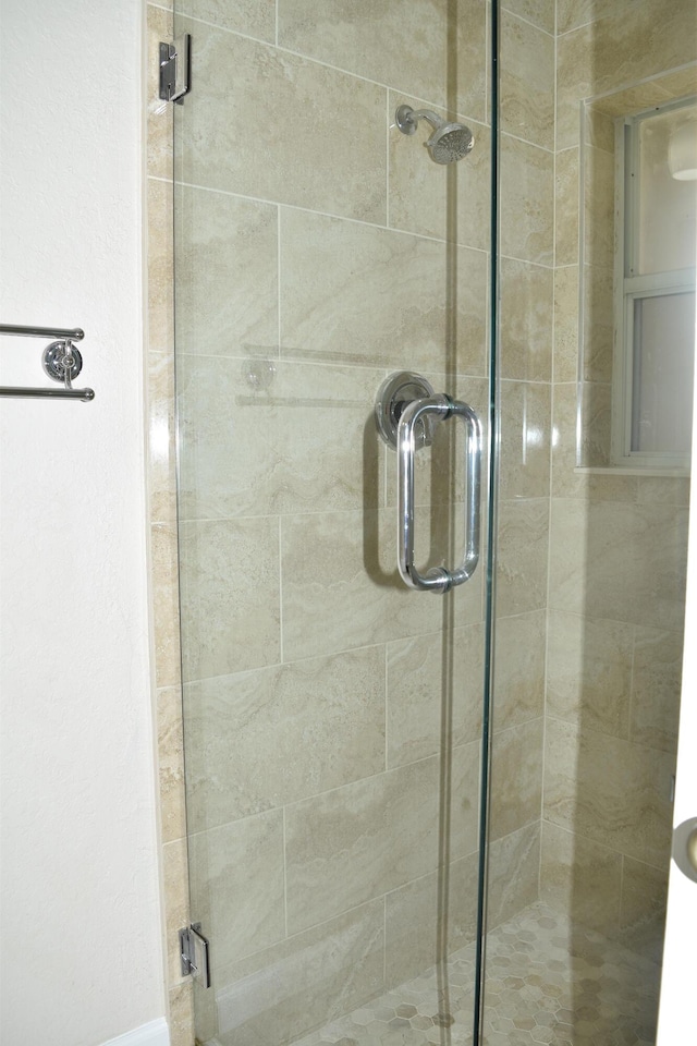 bathroom with a stall shower