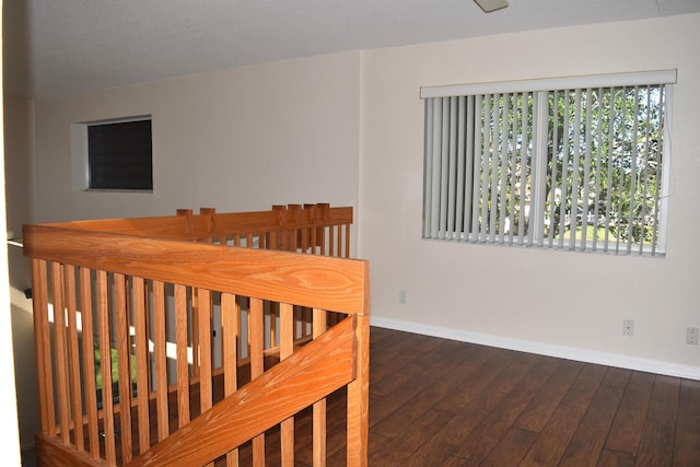 interior space with hardwood / wood-style flooring and baseboards
