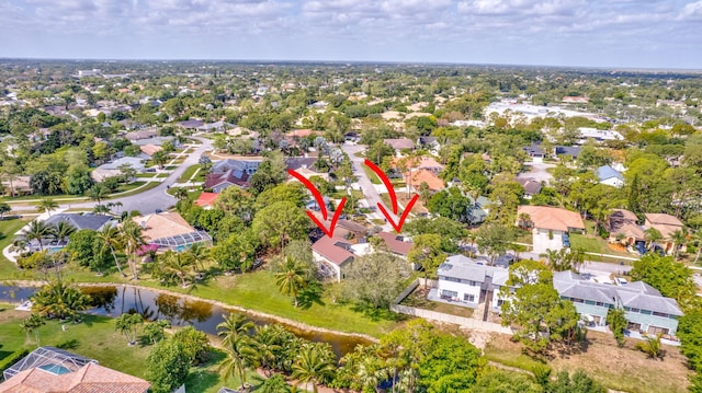 bird's eye view featuring a residential view and a water view