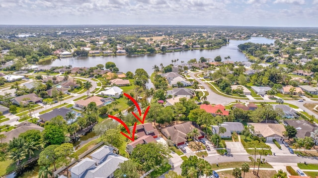 aerial view with a residential view and a water view