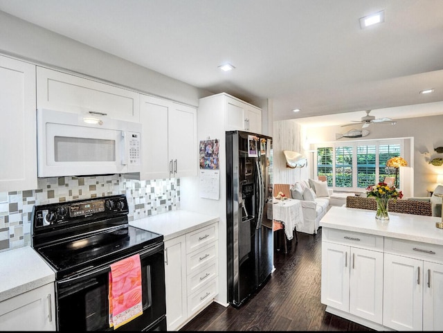 kitchen with light countertops, backsplash, black appliances, and open floor plan