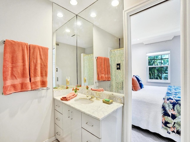 full bath featuring recessed lighting, baseboards, ensuite bathroom, and vanity