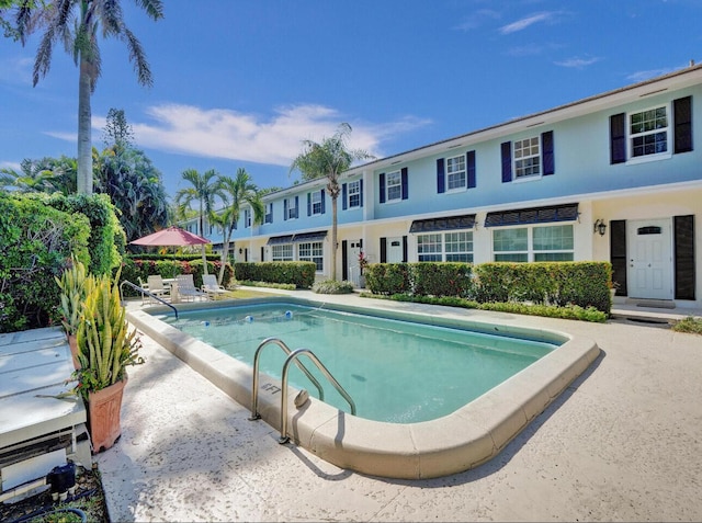 community pool featuring a patio area