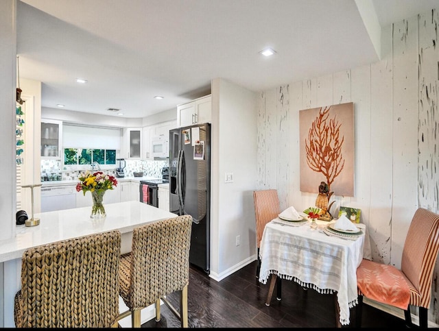 dining room featuring recessed lighting, baseboards, visible vents, and dark wood-type flooring