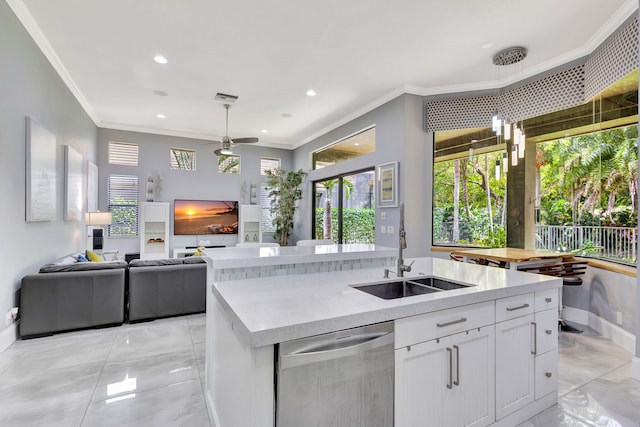 kitchen featuring a sink, crown molding, light countertops, stainless steel dishwasher, and white cabinets