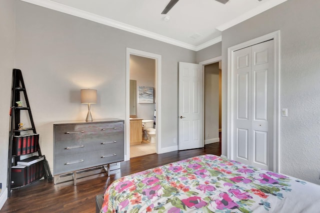 bedroom featuring wood finished floors, ensuite bath, a closet, baseboards, and crown molding