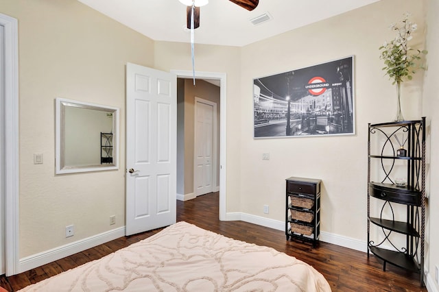 bedroom featuring visible vents, wood finished floors, and baseboards