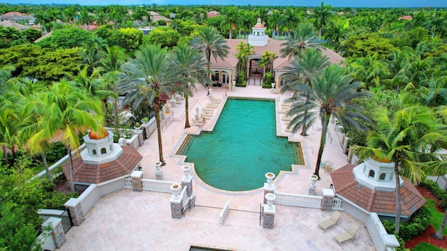 view of pool with fence and a gazebo