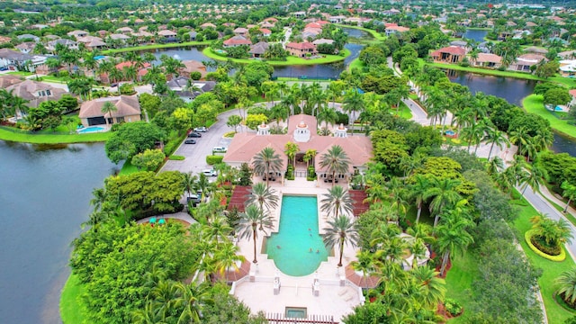 drone / aerial view featuring a residential view and a water view
