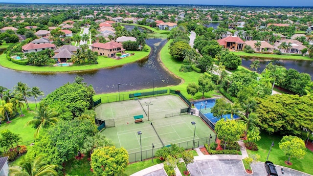 birds eye view of property featuring a water view and a residential view
