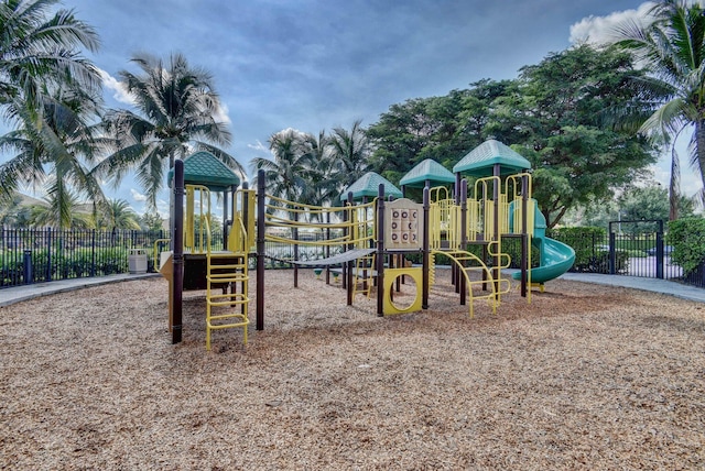 community jungle gym featuring fence