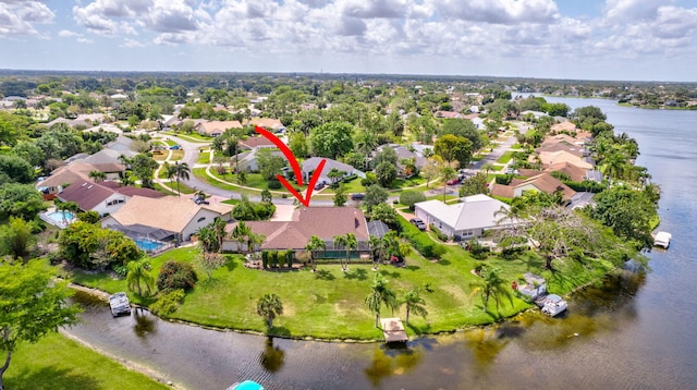 bird's eye view with a residential view and a water view
