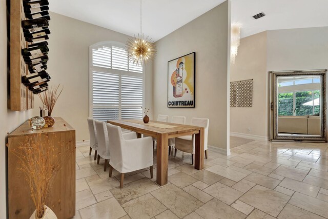 2465 Chesapeake Cir, West Palm Beach, FL 33409 - dining space featuring an inviting chandelier, stone tile floors, baseboards, and visible vents