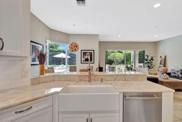 2465 Chesapeake Cir, West Palm Beach, FL 33409 - kitchen with visible vents, a sink, a healthy amount of sunlight, and open floor plan