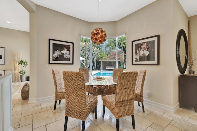 2465 Chesapeake Cir, West Palm Beach, FL 33409 - dining room with stone tile floors, recessed lighting, and baseboards