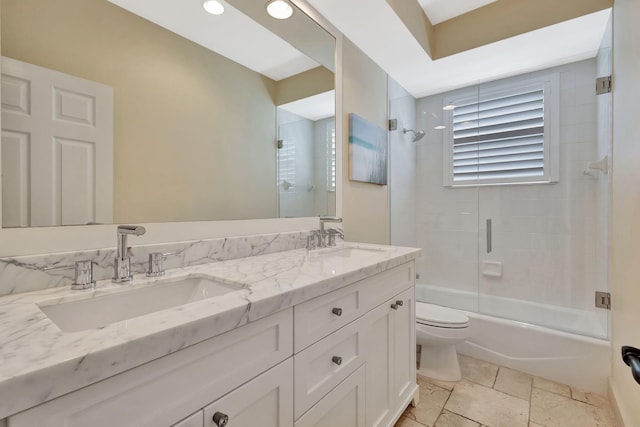 2465 Chesapeake Cir, West Palm Beach, FL 33409 - full bathroom with double vanity, toilet, combined bath / shower with glass door, and a sink