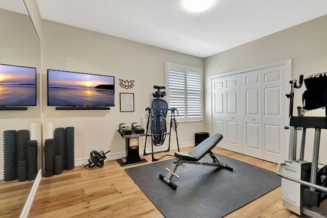 2465 Chesapeake Cir, West Palm Beach, FL 33409 - exercise room with baseboards and wood finished floors