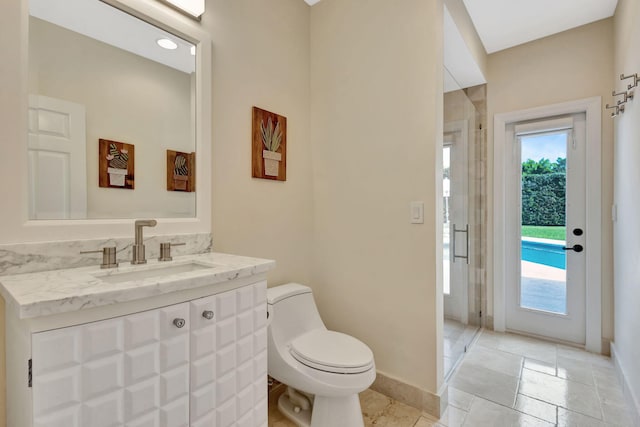 2465 Chesapeake Cir, West Palm Beach, FL 33409 - full bathroom with vanity, baseboards, a stall shower, and toilet