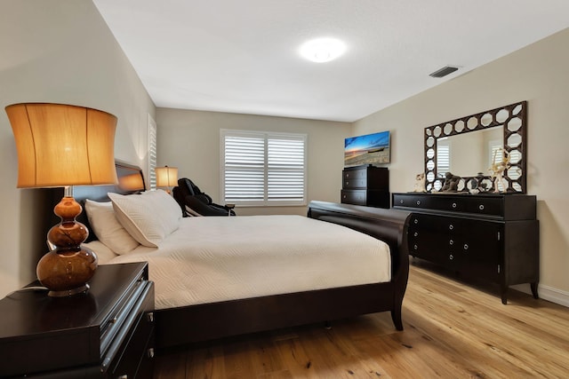 2465 Chesapeake Cir, West Palm Beach, FL 33409 - bedroom with visible vents, light wood-style flooring, and baseboards