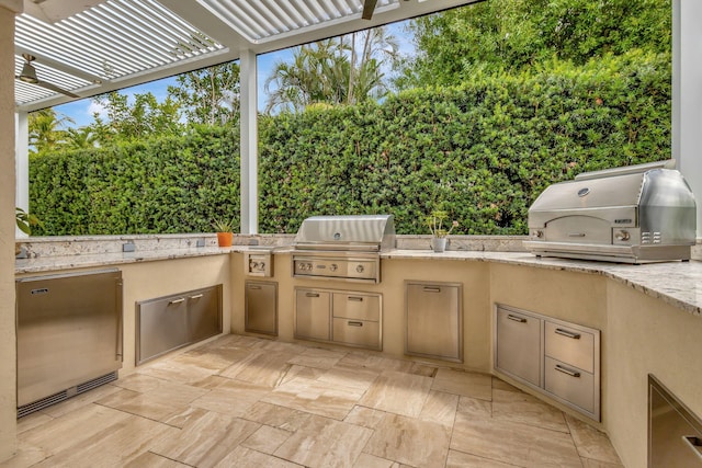 2465 Chesapeake Cir, West Palm Beach, FL 33409 - view of patio featuring exterior kitchen, a pergola, and area for grilling