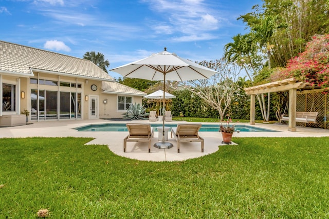 2465 Chesapeake Cir, West Palm Beach, FL 33409 - pool with a lawn, a pergola, and a patio
