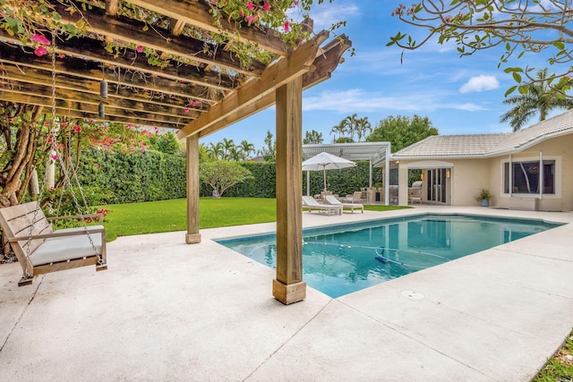 2465 Chesapeake Cir, West Palm Beach, FL 33409 - outdoor pool with a lawn, a pergola, and a patio area