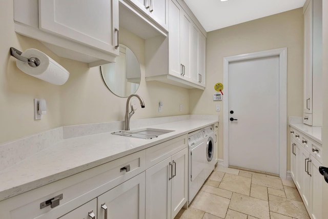 2465 Chesapeake Cir, West Palm Beach, FL 33409 - kitchen with light countertops, white cabinets, a sink, and stone tile flooring