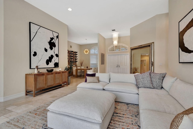 2465 Chesapeake Cir, West Palm Beach, FL 33409 - living area with baseboards and a notable chandelier