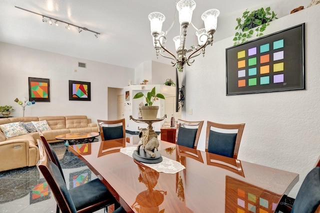 dining area with an inviting chandelier and visible vents
