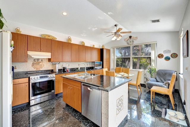 kitchen featuring a ceiling fan, visible vents, appliances with stainless steel finishes, a sink, and under cabinet range hood