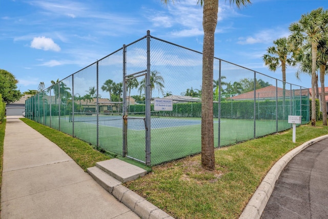 view of sport court with fence