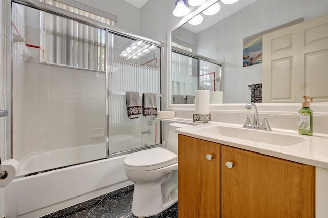 full bathroom featuring toilet, combined bath / shower with glass door, and vanity