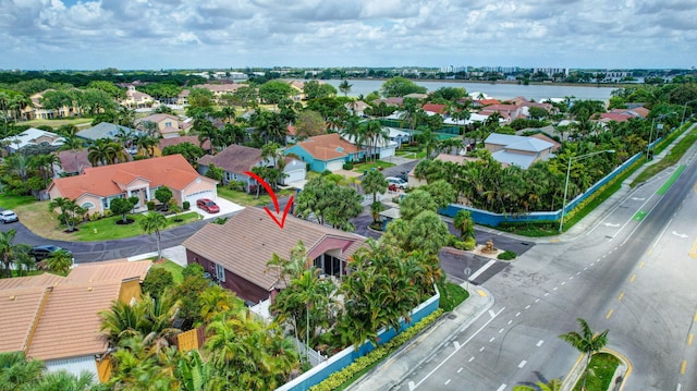 bird's eye view featuring a water view and a residential view
