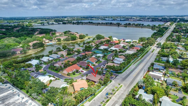birds eye view of property with a residential view and a water view