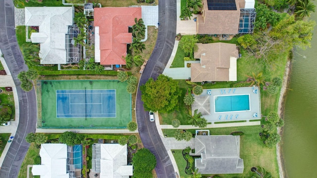drone / aerial view with a residential view and a water view