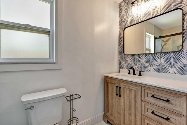 5810 Tucker Rd, Jupiter, FL 33458 - bathroom with toilet, plenty of natural light, vanity, a shower with shower curtain, and wallpapered walls
