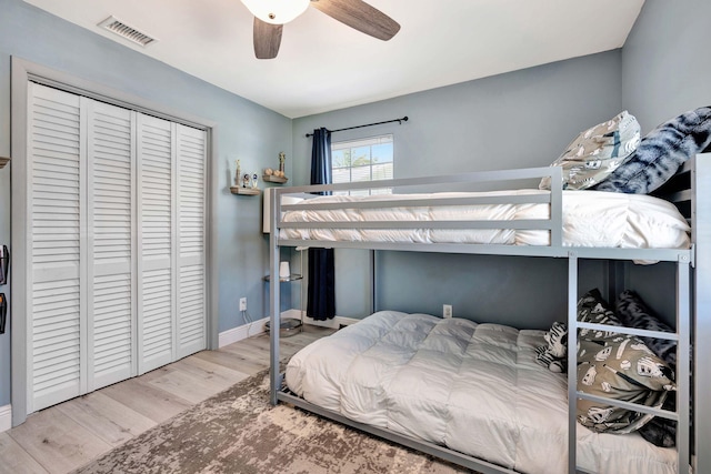 5810 Tucker Rd, Jupiter, FL 33458 - bedroom featuring wood finished floors, a closet, a ceiling fan, and baseboards