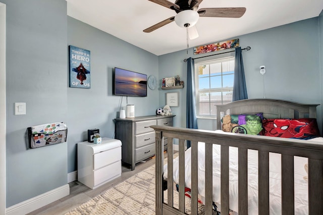 5810 Tucker Rd, Jupiter, FL 33458 - bedroom with light wood-style flooring, baseboards, and a ceiling fan