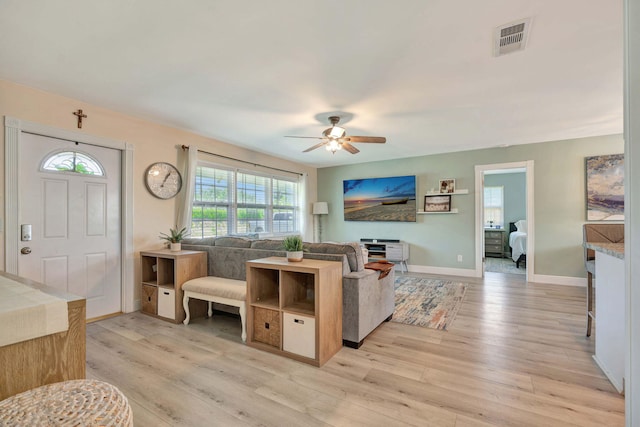 5810 Tucker Rd, Jupiter, FL 33458 - living area featuring ceiling fan, light wood-style flooring, and baseboards