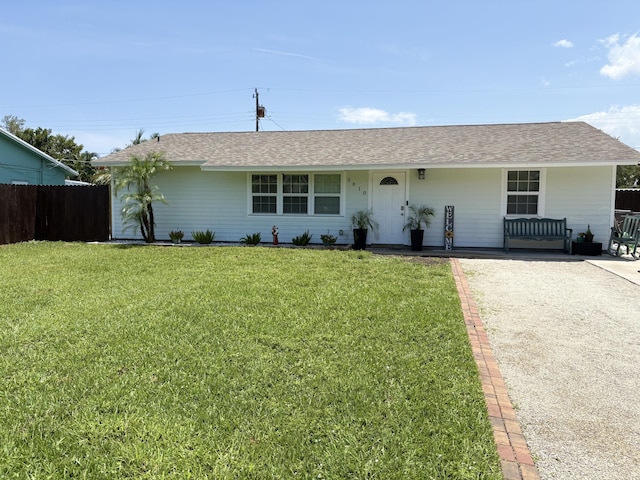 5810 Tucker Rd, Jupiter, FL 33458 - single story home with a shingled roof and covered porch
