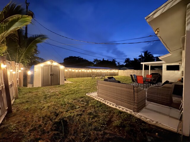 5810 Tucker Rd, Jupiter, FL 33458 - yard at night with a patio