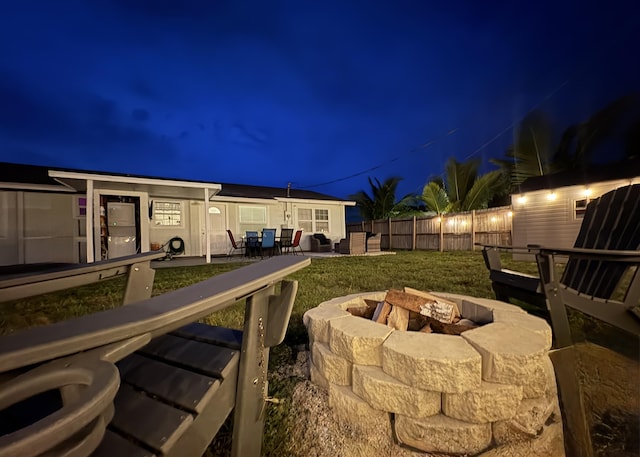 5810 Tucker Rd, Jupiter, FL 33458 - patio at night featuring a fire pit and a patio
