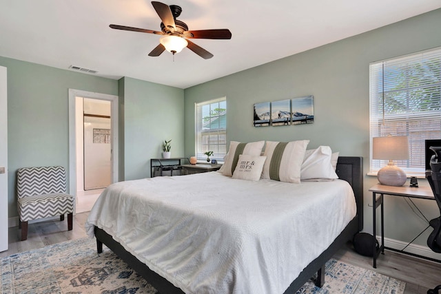 5810 Tucker Rd, Jupiter, FL 33458 - bedroom featuring wood finished floors, ceiling fan, and baseboards