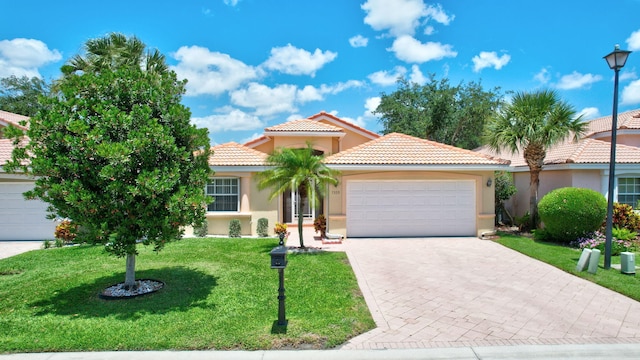 ranch-style house with an attached garage, decorative driveway, a front lawn, and stucco siding