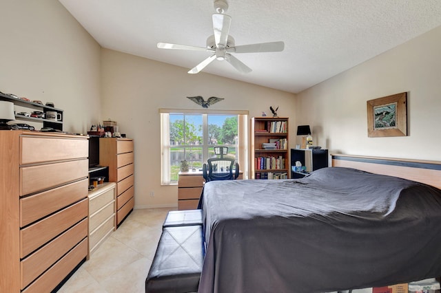 bedroom with a ceiling fan, light tile patterned floors, and lofted ceiling