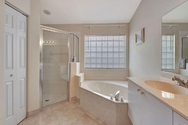 full bath with a garden tub, vanity, a healthy amount of sunlight, and a shower stall
