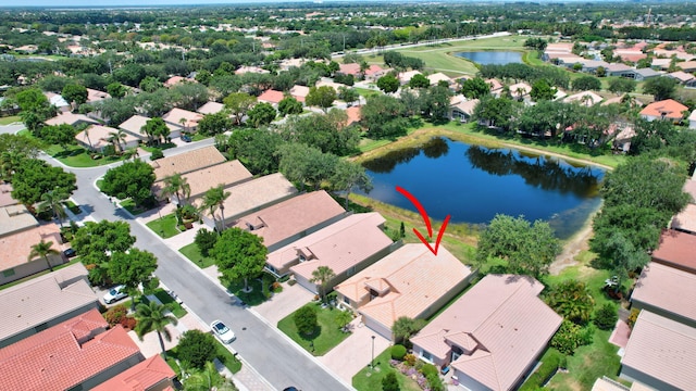 bird's eye view featuring a water view and a residential view