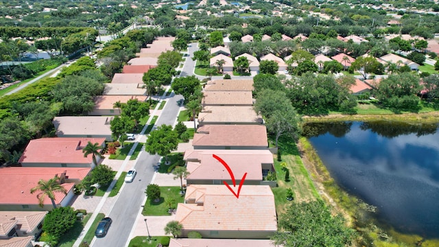 bird's eye view featuring a water view and a residential view